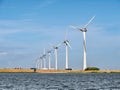 Windturbines of wind park on coast of Ketelmeer, Flevoland, Netherlands Royalty Free Stock Photo