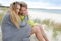 Windy autumn days relaxing on coast - sand dune, beach, beautiful couple Royalty Free Stock Photo