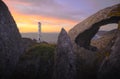 Lighthouse hidden between magical stones.