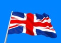 windy flowing United Kingdom National Flag with clipping path isolated on blue sky background Royalty Free Stock Photo