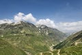 Windy road among high green mountains