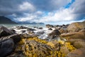 Windy seascape. Dramatic cloudy sky over stone seaside. Royalty Free Stock Photo