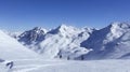 windy snowy mountianscape of view of skiers on a slope in val thorens france