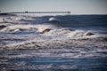 Windy waves roll into shore by Venice Pier, Florida