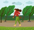 Windy weather, woman walking in park through strong wind, green trees bend, leaves flying in air