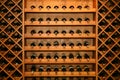 Wine. Luxury home wine cellar. Bottles of wine stacked end on in a large wine rack in a winery. horizontally, diagonal Wine Rack