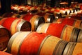 Wine ages in wooden barrels in a cellar