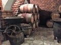 Wine aging in barrels in a cellar