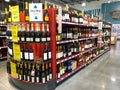 The wine aisle of a Whole Foods Market grocery store with a variety of wines from various vineyards