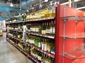 The wine aisle of a Whole Foods Market grocery store with a variety of wines from various vineyards