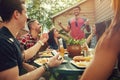 Wine, anyone. a group of friends having lunch in their backyard. Royalty Free Stock Photo