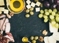 Wine appetizer set: cheese and meat selection with grapes, honey