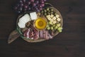 Wine appetizers set: meat and cheese selection, honey, grapes Royalty Free Stock Photo