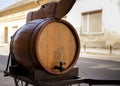 Wine barrel mad from wood in front of the wine celler Royalty Free Stock Photo