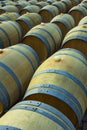 Wine barrels in the antique cellar. Cavernous wine cellar with stacked oak barrels for maturing red wine. Royalty Free Stock Photo