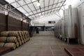 Wine barrels and fermentation tanks at the winery Viu Manent.