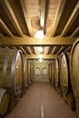 Wine barrels stacked in the old cellar Royalty Free Stock Photo