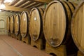 Wine barrels stacked in the old cellar Royalty Free Stock Photo