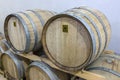 Wine barrels stacked in the old cellar of the winery. Royalty Free Stock Photo