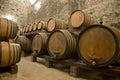 Wine barrels stacked in the old cellar of the winery, Royalty Free Stock Photo