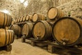 Wine barrels stacked in the old cellar of the winery Royalty Free Stock Photo