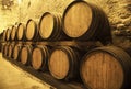 Wine barrels stacked in the old cellar of the winery Royalty Free Stock Photo