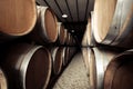 Wine barrels stacked in old winery cellar. Vintage retro effect Royalty Free Stock Photo