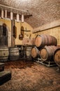 Wine Barrels Stacked in Winery Cellar Royalty Free Stock Photo