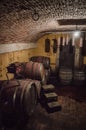 Wine Barrels Stacked in Winery Cellar Royalty Free Stock Photo