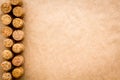 Wine bottle corks pattern on craft paper background top view copyspace. New Year celebration concept Royalty Free Stock Photo