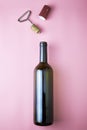 Wine bottle corkscrew stopper and shrink cap on pink background Royalty Free Stock Photo