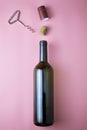 wine bottle corkscrew stopper and shrink cap on pink background Royalty Free Stock Photo