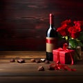 wine bottle and glass, accompanied by roses and a box of chocolates, symbolizing a romantic date Royalty Free Stock Photo