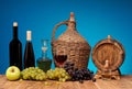 Wine bottle and glass, apples and grapes Royalty Free Stock Photo