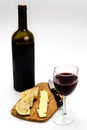 Wine Bottle with Glass Cheese Bread Cutting Board Royalty Free Stock Photo