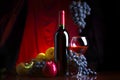 Wine. Bottle and glass of red wine with ripe grapes still life. Red wine. Royalty Free Stock Photo