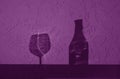 Wine bottle and glass shadow in purple tone Royalty Free Stock Photo