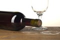 Wine bottle and glass on wooden background