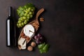 Wine bottle, grape and cheese Royalty Free Stock Photo