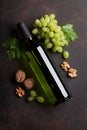 Wine bottle, grape and nuts Royalty Free Stock Photo