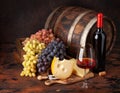 Wine bottle, grapes, cheese and glass of red wine Royalty Free Stock Photo