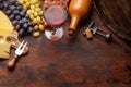 Wine bottle, grapes, glass of red wine and old barrel Royalty Free Stock Photo