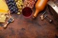 Wine bottle, grapes, glass of red wine and old barrel Royalty Free Stock Photo