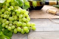 Wine bottle and grapes on wooden table. Top view with space for Royalty Free Stock Photo