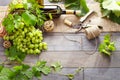 Wine bottle and grapes on wooden table. Top view with space for Royalty Free Stock Photo