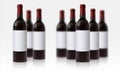 Wine bottle mockup. Realistic blurred 3D glass vessels with red beverage and blank white labels. Alcoholic product