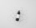 Wine bottle mockup on white cracked background.
