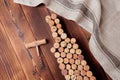 Wine bottle shaped corks and corkscrew over rustic wooden table background and burlap. Top view with copy space - image Royalty Free Stock Photo