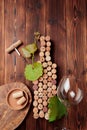 Wine bottle shaped corks and corkscrew over rustic wooden table background and burlap. Top view with copy space - image Royalty Free Stock Photo