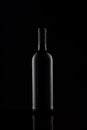 Wine bottle silhouette isolated on dark background. Mockup of bottle on dark backdrop. Royalty Free Stock Photo